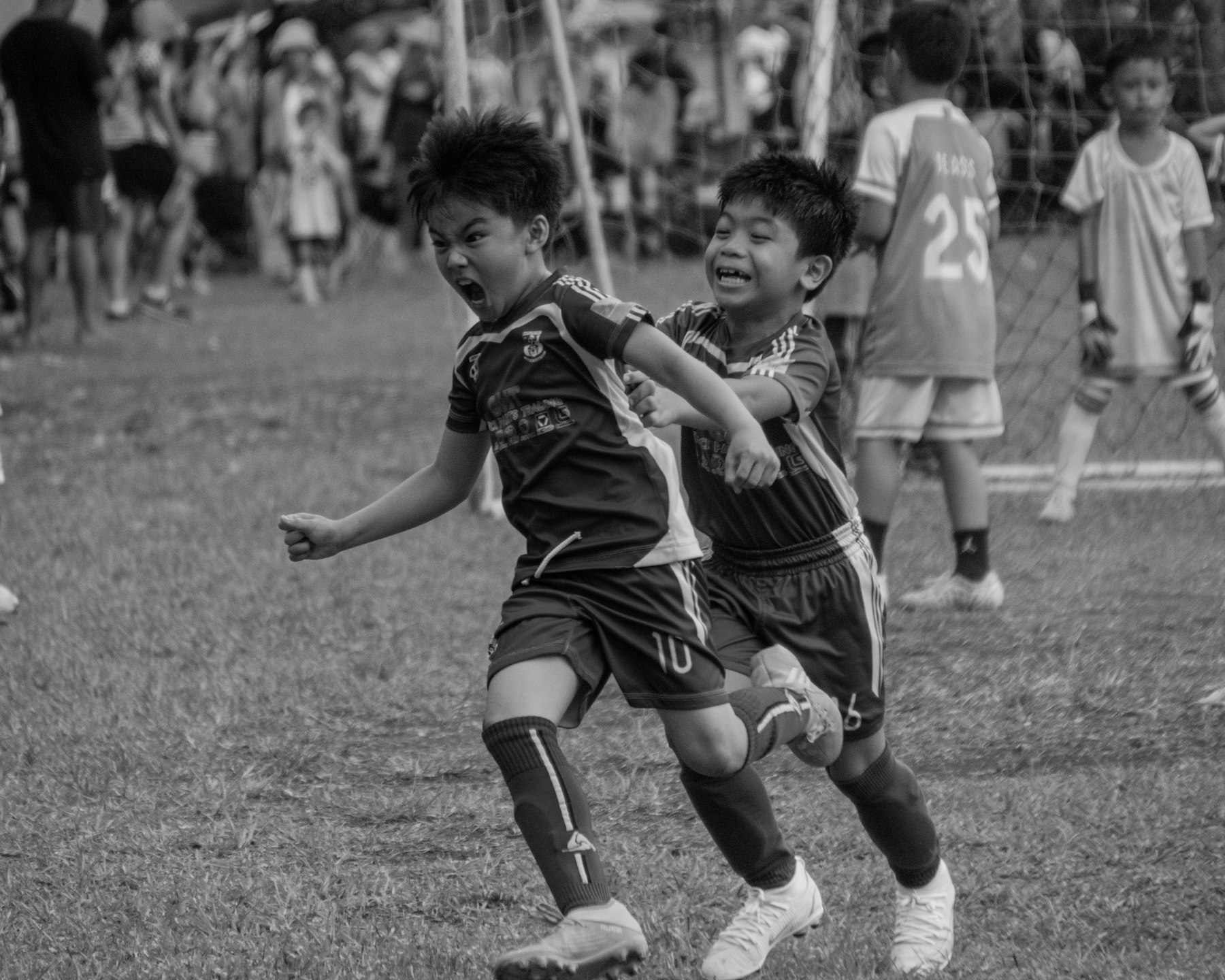 Kids celebrating during a youth soccer game